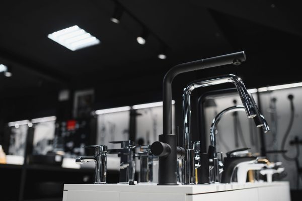 Rows of new faucets in plumbing shop.